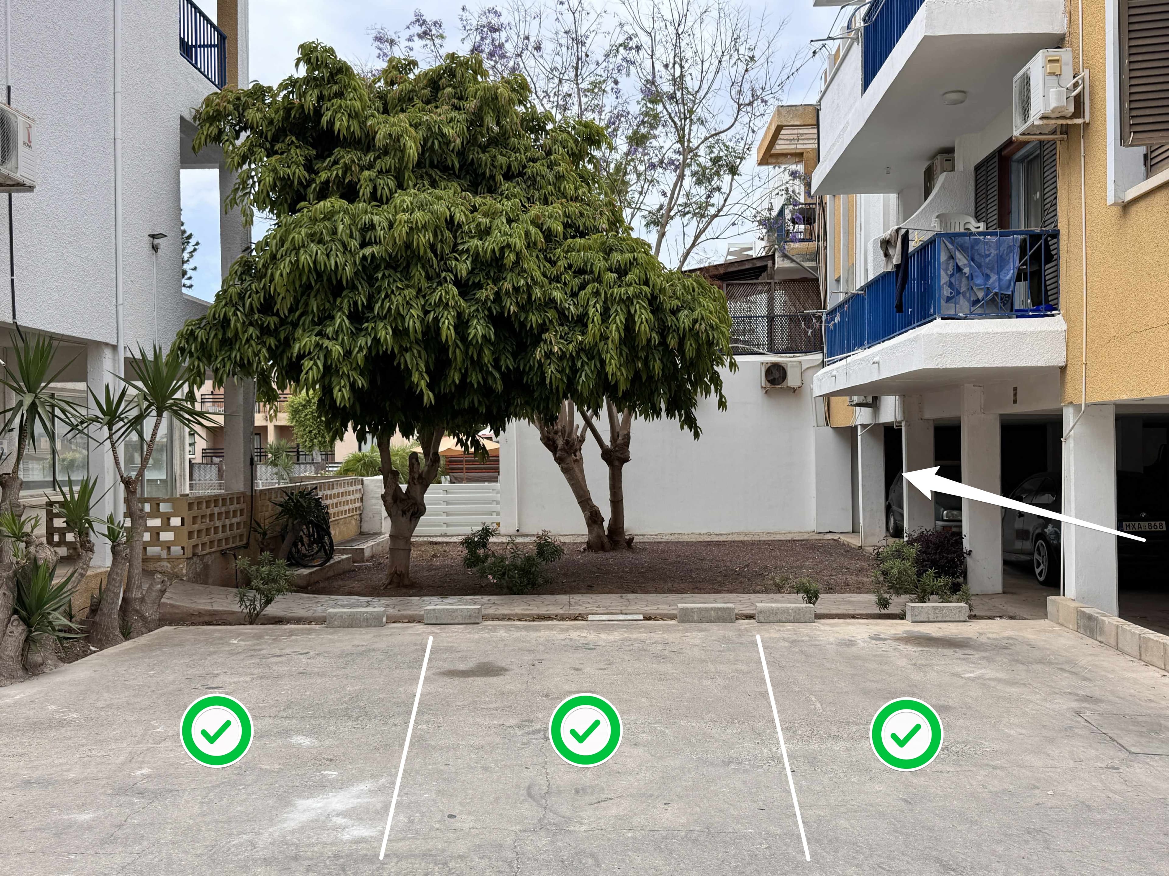 Uncovered car parking area inside the complex